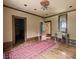 Home office featuring stained glass window and period writing desk, with hardwood flooring at 114 Lees Lake Rd, Fayetteville, GA 30214