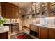 Walk-in pantry with custom wood cabinets, stainless sink and granite counters at 114 Lees Lake Rd, Fayetteville, GA 30214