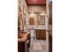 Charming powder room with elegant wood cabinetry, decorative accents, and a vintage-style vanity at 114 Lees Lake Rd, Fayetteville, GA 30214