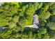 Overhead view of home nestled among lush, mature trees providing privacy and shade at 207 Lees Lake Rd, Fayetteville, GA 30214