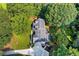 Birds eye view of a house with a grey roof and lush green surroundings at 207 Lees Lake Rd, Fayetteville, GA 30214