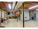 Large unfinished basement offering lots of potential with exposed ceiling and bright lighting at 207 Lees Lake Rd, Fayetteville, GA 30214