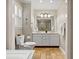 Bathroom featuring a toilet and double sink vanity with mirror and unique tiled flooring at 207 Lees Lake Rd, Fayetteville, GA 30214