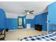 Blue bedroom featuring a bed, desk, and attic nook at 207 Lees Lake Rd, Fayetteville, GA 30214