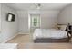 Bedroom featuring a bed, tv, and large window at 207 Lees Lake Rd, Fayetteville, GA 30214