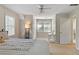 Bright bedroom featuring a ceiling fan, natural light, and neutral decor creating a relaxing atmosphere at 207 Lees Lake Rd, Fayetteville, GA 30214
