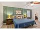 Bedroom showcasing a bed with a blue quilt, an accent wall, and a closet at 207 Lees Lake Rd, Fayetteville, GA 30214