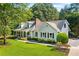 Beautiful one-story home with a classic design, landscaped yard, and inviting covered front porch at 207 Lees Lake Rd, Fayetteville, GA 30214