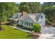 Aerial view of home with a large yard and driveway at 207 Lees Lake Rd, Fayetteville, GA 30214