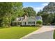 Charming home with well-maintained lawn and landscaping at 207 Lees Lake Rd, Fayetteville, GA 30214
