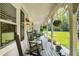 Inviting front porch featuring rocking chairs and hanging plants, perfect for relaxing outdoors at 207 Lees Lake Rd, Fayetteville, GA 30214
