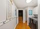Hallway with a laundry area and hooks for hanging items at 207 Lees Lake Rd, Fayetteville, GA 30214