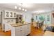 Eat-in kitchen featuring white cabinets, an island, and stainless steel appliances at 207 Lees Lake Rd, Fayetteville, GA 30214