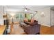 Comfortable living room featuring hardwood floors, a fireplace, and cozy seating at 207 Lees Lake Rd, Fayetteville, GA 30214