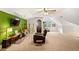 Inviting room with vaulted ceilings, a green accent wall, and cozy seating arrangement at 207 Lees Lake Rd, Fayetteville, GA 30214
