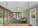 Charming screened-in porch with swing and comfortable seating, ideal for relaxation at 207 Lees Lake Rd, Fayetteville, GA 30214