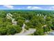 The neighborhood is surrounded by a canopy of lush, mature trees at 2688 Beddington Way, Suwanee, GA 30024