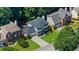 Aerial view of the property highlighting the well-manicured lawn, landscaping, and architectural features of the home at 2688 Beddington Way, Suwanee, GA 30024