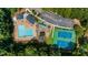 Bird's eye view of the community featuring a swimming pool, playground, and tennis courts at 2688 Beddington Way, Suwanee, GA 30024