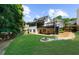 Sprawling backyard includes patio, deck, and fire pit at 2688 Beddington Way, Suwanee, GA 30024