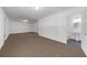 Unfinished basement leads to tidy bathroom at 2688 Beddington Way, Suwanee, GA 30024