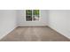Bright bedroom with a large window and neutral carpet flooring at 2688 Beddington Way, Suwanee, GA 30024