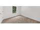 Bedroom with soft carpet and bright natural light from a large window at 2688 Beddington Way, Suwanee, GA 30024