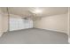 Spacious two car garage with white doors and ample room for storage and parking at 2688 Beddington Way, Suwanee, GA 30024
