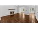 Living room features hardwood floors, a fireplace, and an open floor plan at 2688 Beddington Way, Suwanee, GA 30024