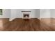 Living room features hardwood floors, a fireplace, and bright natural light at 2688 Beddington Way, Suwanee, GA 30024