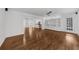 Bright living room with hardwood floors, built-in shelving, and abundant natural light at 2688 Beddington Way, Suwanee, GA 30024