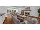 Spacious living room showcases hardwood floors, a fireplace, and an open layout into the dining area at 2688 Beddington Way, Suwanee, GA 30024