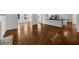 Expansive living room with pristine hardwood floors and a modern, open floor plan at 2688 Beddington Way, Suwanee, GA 30024