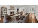 Bright living room boasts hardwood floors, fireplace, and stylish decor with views of the entry at 2688 Beddington Way, Suwanee, GA 30024
