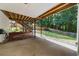 Covered concrete patio leads to backyard and a wood fence at 2688 Beddington Way, Suwanee, GA 30024