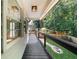 Lovely porch with black railings looks out over green backyard at 2688 Beddington Way, Suwanee, GA 30024