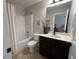 Clean bathroom with a shower-tub combo, tile flooring, and a large mirror at 4745 Belcrest Way, Cumming, GA 30040