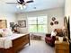 Charming bedroom with natural light, ceiling fan, and an inviting, cozy atmosphere at 4745 Belcrest Way, Cumming, GA 30040
