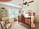 Bright bedroom with a vaulted ceiling, ceiling fan, and a charming chair at 4745 Belcrest Way, Cumming, GA 30040