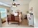 Bedroom features vaulted ceiling, ceiling fan, carpet, and an abundance of natural light at 4745 Belcrest Way, Cumming, GA 30040