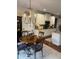 Cozy dining area with chandelier, seamlessly connected to the stylish kitchen at 4745 Belcrest Way, Cumming, GA 30040