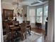 Bright dining room with bay windows, chandelier, and hardwood floors at 4745 Belcrest Way, Cumming, GA 30040