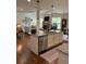 Open concept kitchen with granite counters, stainless appliances, and seamless flow to living spaces at 4745 Belcrest Way, Cumming, GA 30040