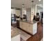 Kitchen island features stainless steel appliances and a granite countertop at 4745 Belcrest Way, Cumming, GA 30040