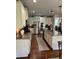 Bright kitchen with stainless steel appliances, white cabinets, and granite countertops at 4745 Belcrest Way, Cumming, GA 30040