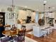 Kitchen with granite counters, island seating, pendant lighting, and stainless appliances at 4745 Belcrest Way, Cumming, GA 30040