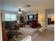 Cozy carpeted living room with comfortable seating and a ceiling fan at 4745 Belcrest Way, Cumming, GA 30040