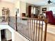 Staircase landing leads to a cozy and inviting living room space at 4745 Belcrest Way, Cumming, GA 30040