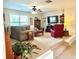 Cozy carpeted living room with comfortable seating and a ceiling fan at 4745 Belcrest Way, Cumming, GA 30040