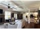 Open-concept living area featuring fireplace, coffered ceilings, and hardwood floors at 4745 Belcrest Way, Cumming, GA 30040